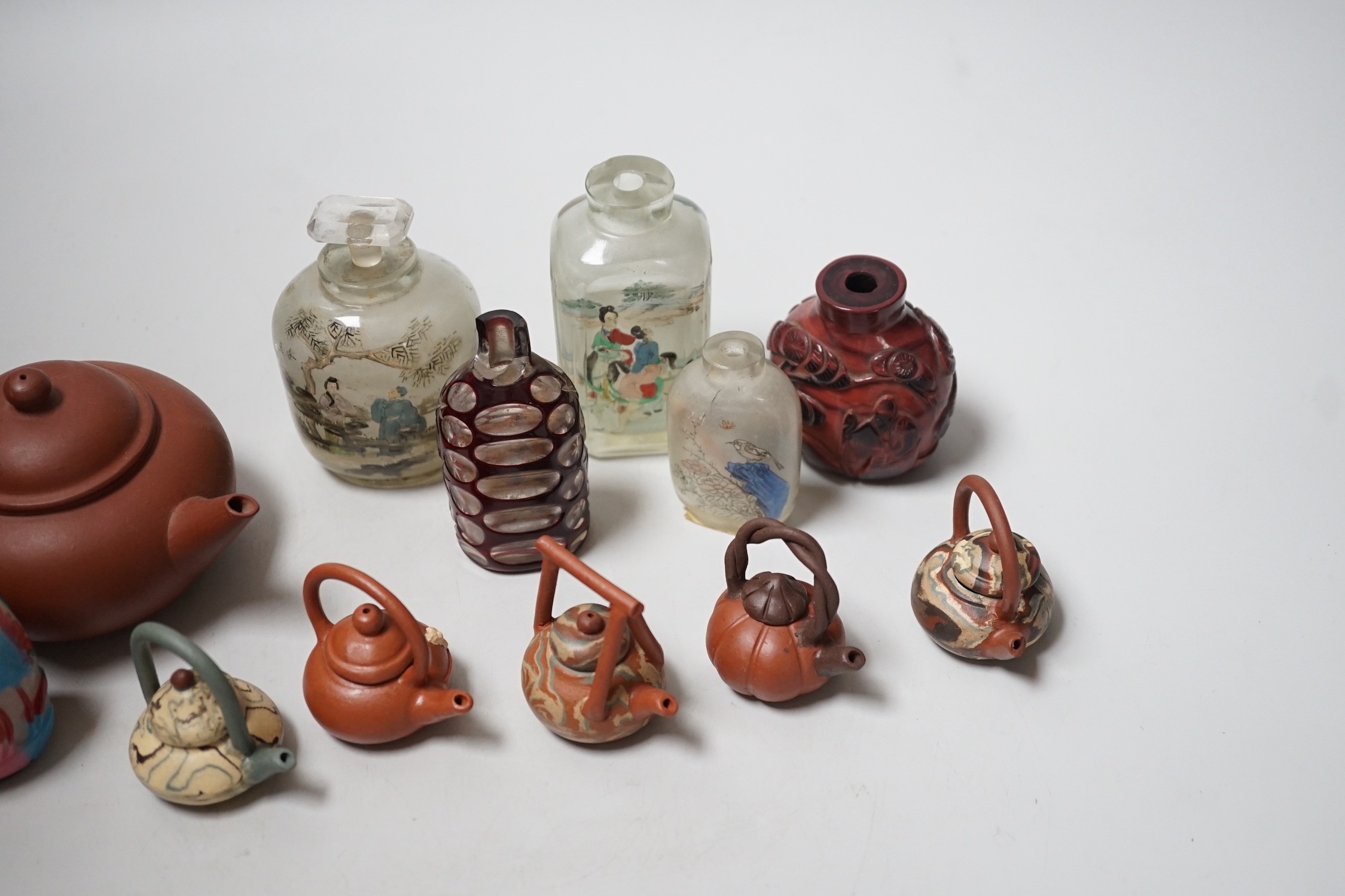 A collection of Chinese scent bottles, miniature and yixing teapots